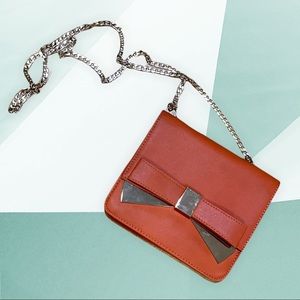 Orange chain strap bow bag